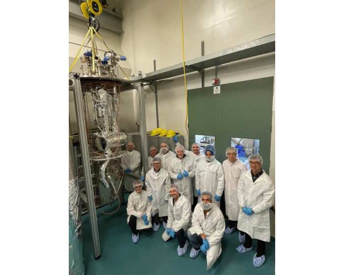 people in white coats with silver colour equipment